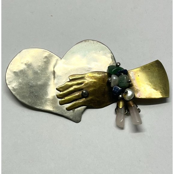 Vintage hammered hand holding heart brooch pin